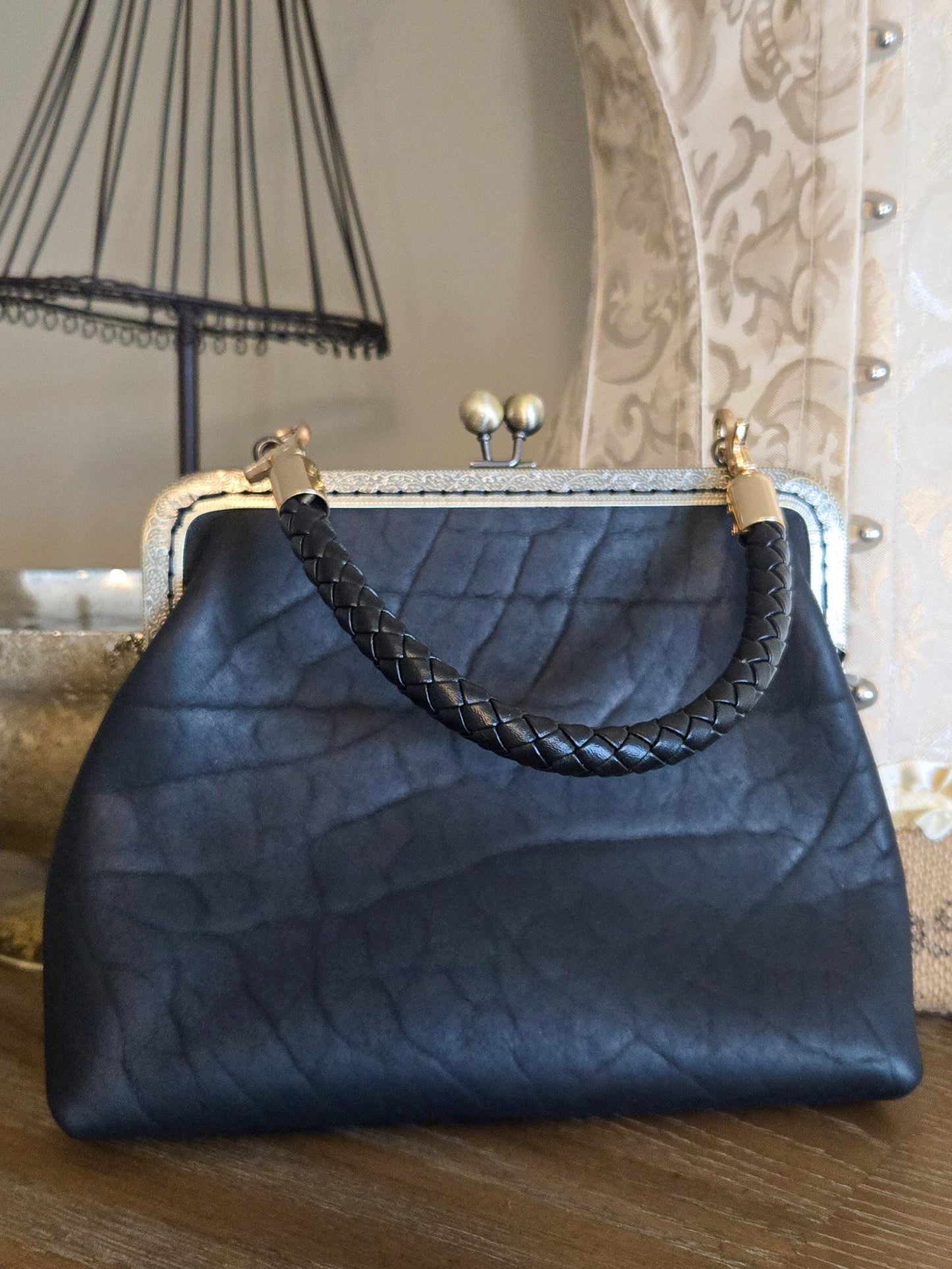 Small Black Leather Handbag with Ball Clasp Closure