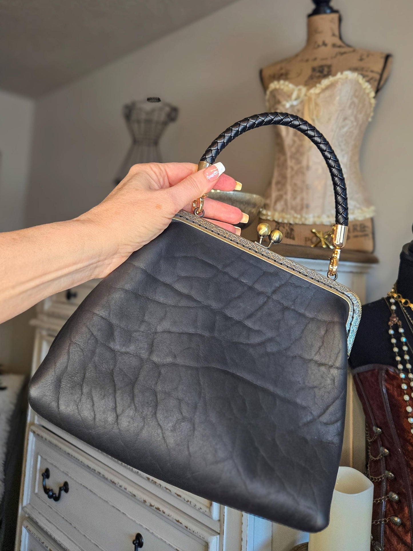 Small Black Leather Handbag with Ball Clasp Closure