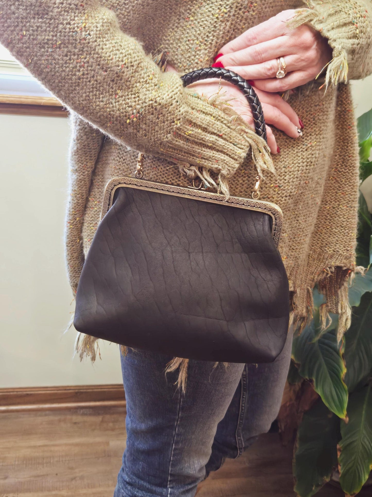 Small Black Leather Handbag with Ball Clasp Closure