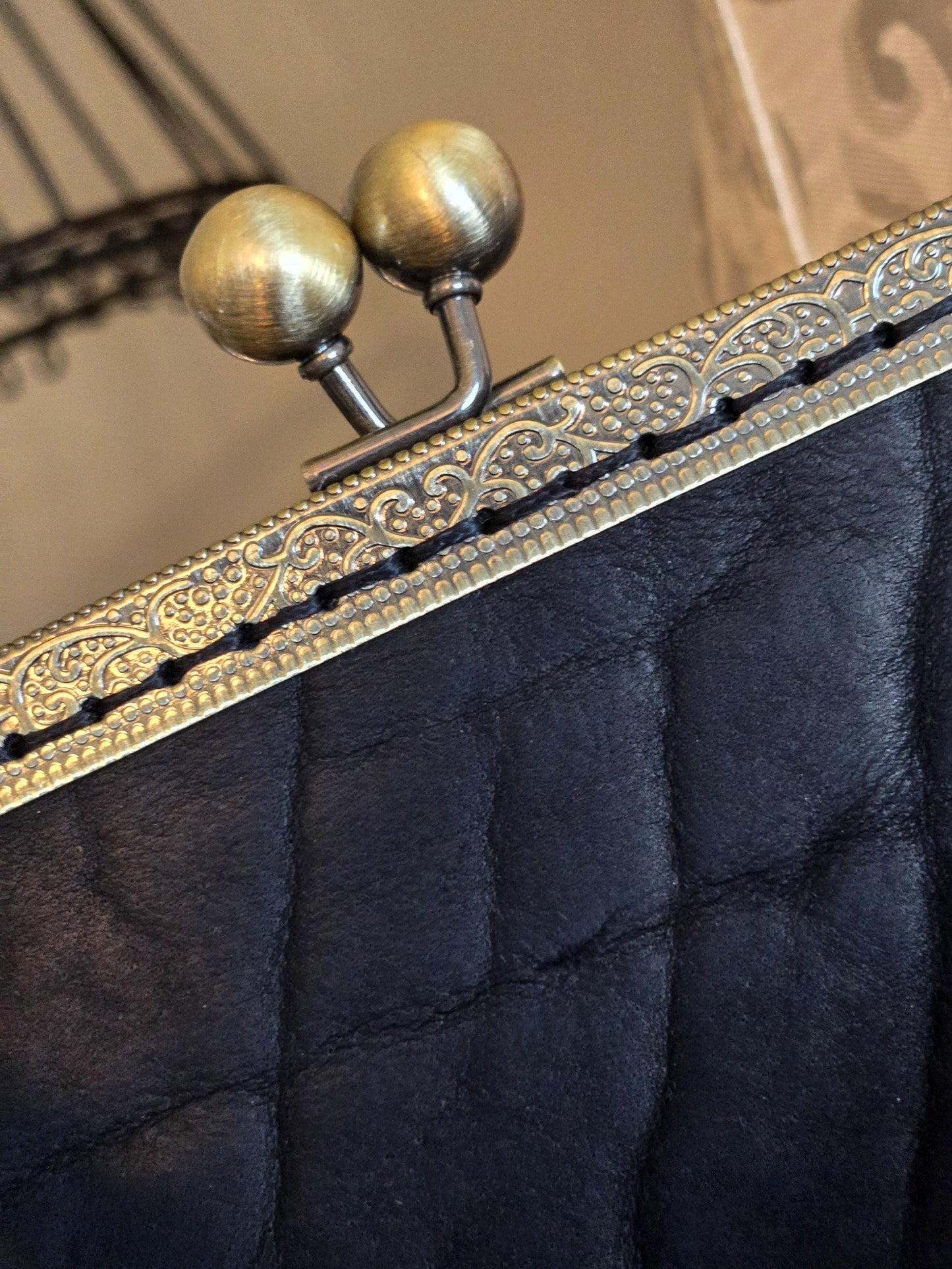 Small Black Leather Handbag with Ball Clasp Closure