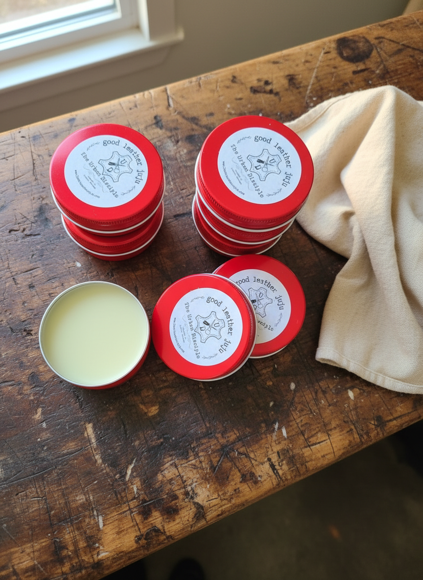Red tins with white labels on a wooden surface