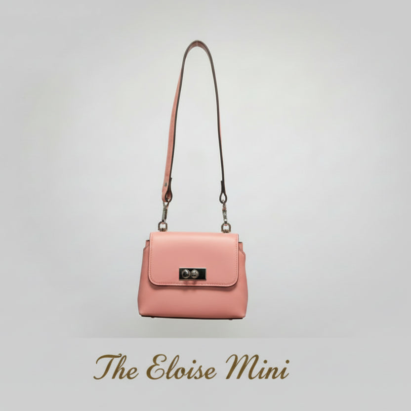 Pink handbag with a strap on a light gray background