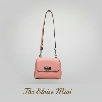 Pink handbag with a strap on a light gray background