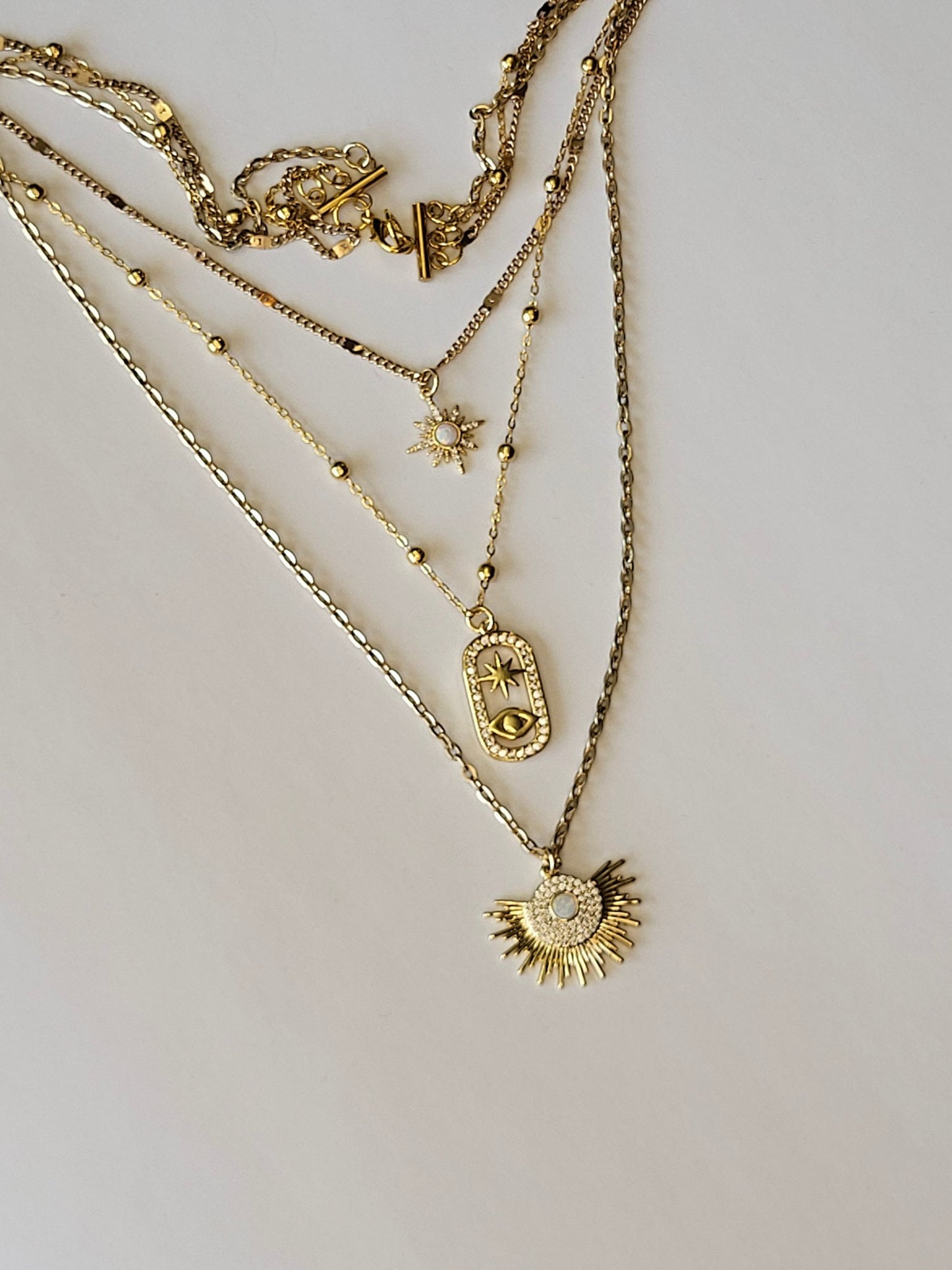 Unique Three-in-One gold Necklace Featuring Opal Starburt & Evil Eye Pendants