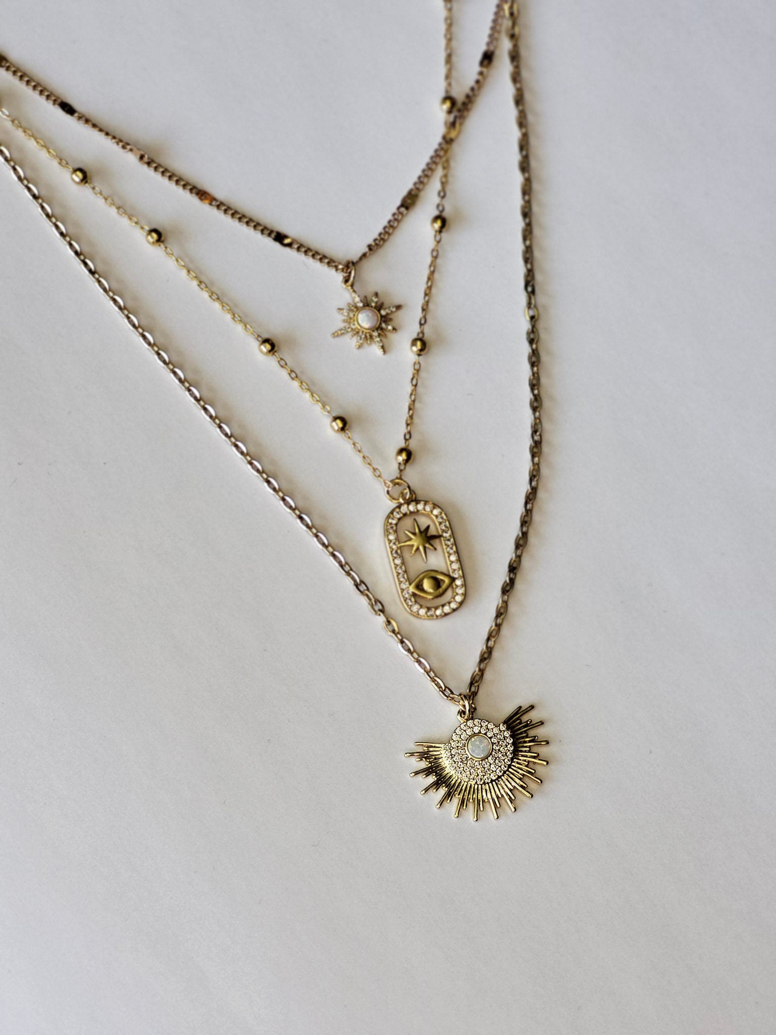 Unique Three-in-One gold Necklace Featuring Opal Starburt & Evil Eye Pendants