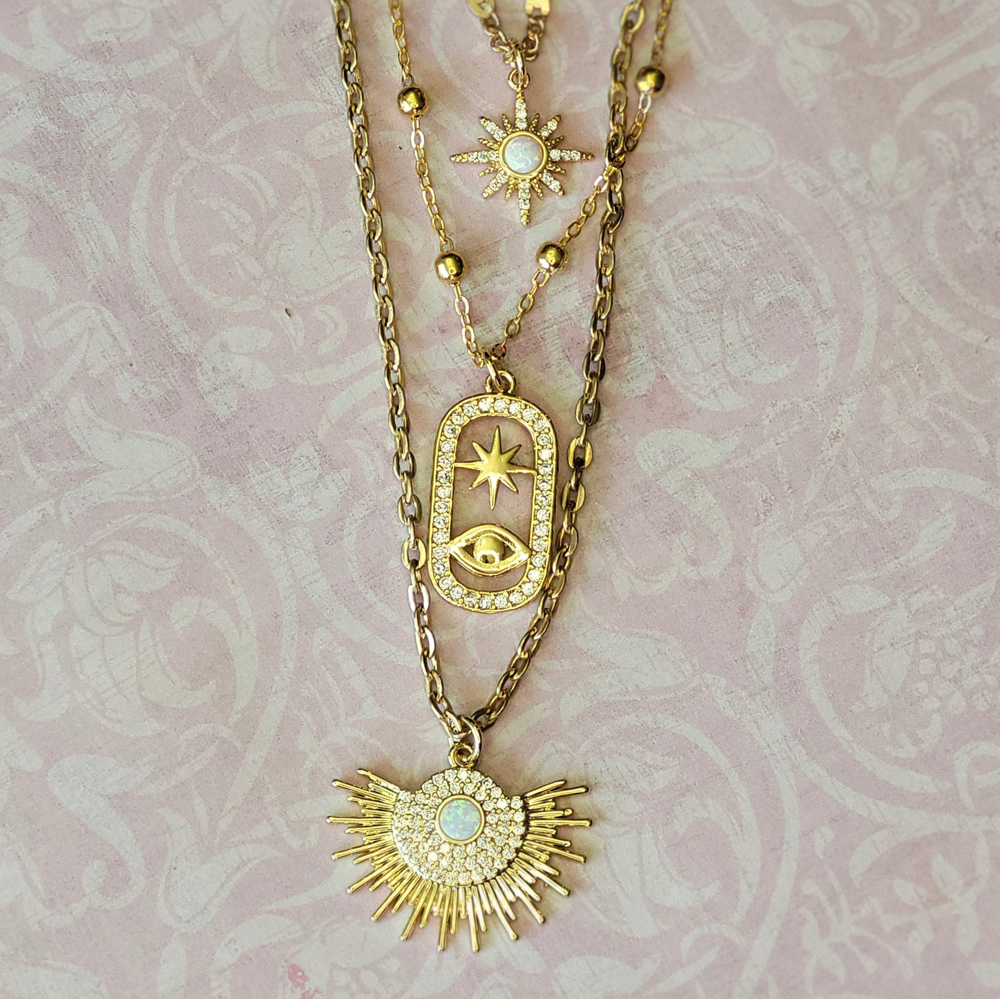 Unique Three-in-One gold Necklace Featuring Opal Starburt & Evil Eye Pendants