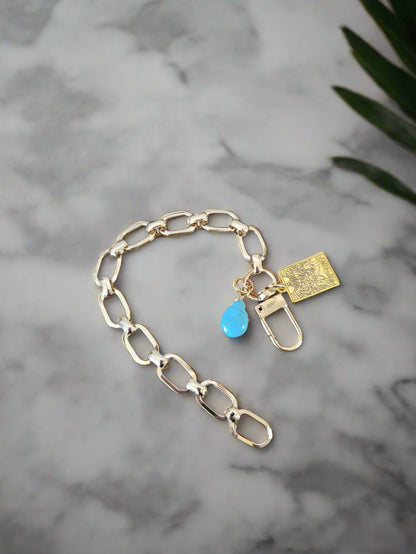 Chunky gold link bracelet with 2 charms, a genuine turquoise drop and a gold tarot card.