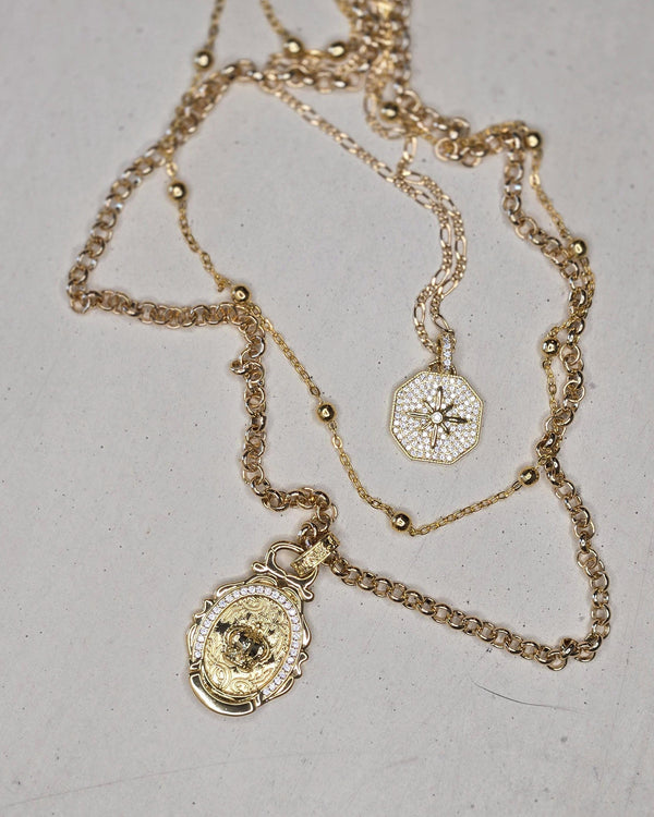 Celestial Royalty, Layered Necklace – Pave Starburst, Satellite Chain & Crown Medallion in Gold Tone Finish