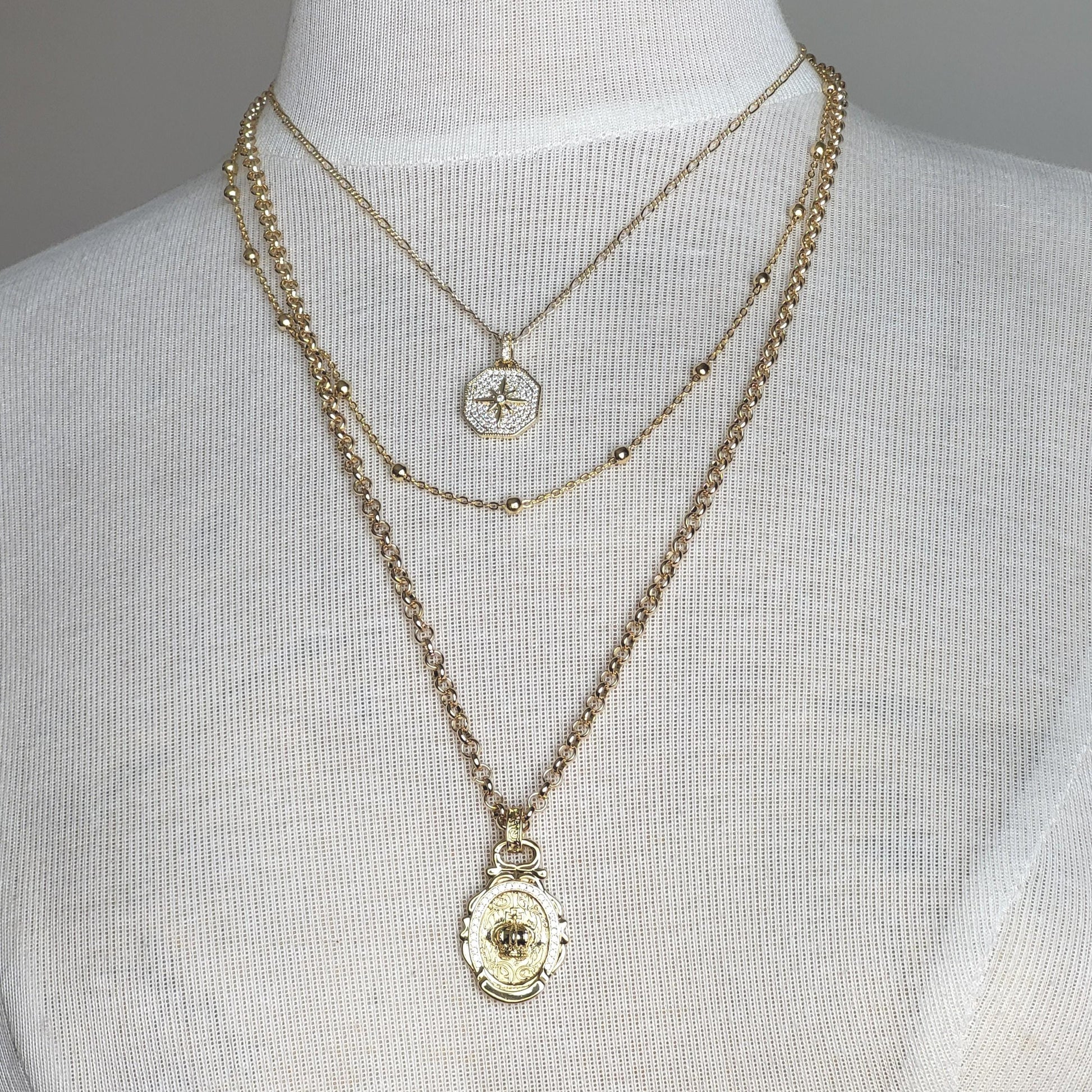 Celestial Royalty, Layered Necklace – Pave Starburst, Satellite Chain & Crown Medallion in Gold Tone Finish