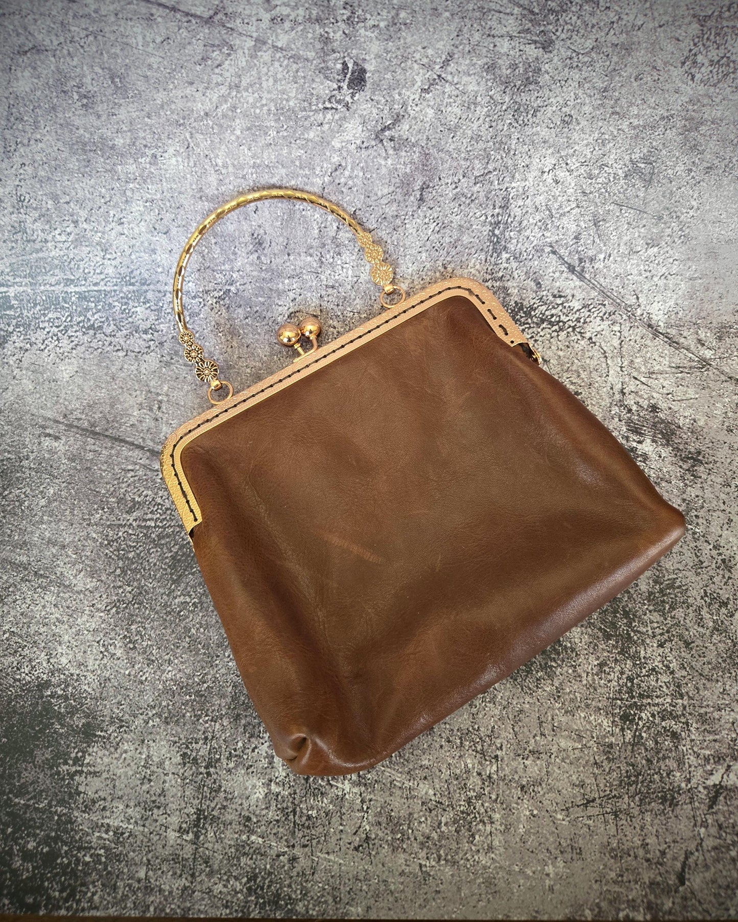 Small Brown Leather Handbag with Ball Clasp Closure