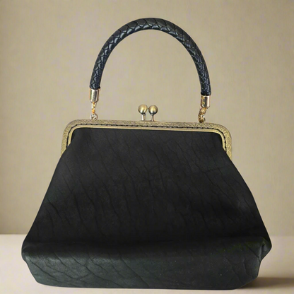 Small Black Leather Handbag with Ball Clasp Closure