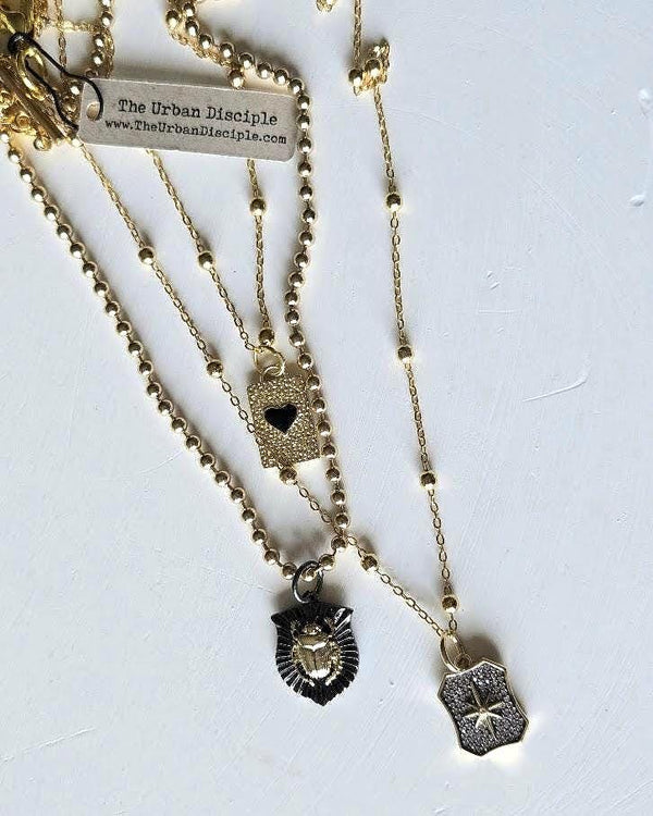 Triple Strand Necklace with Heart, Scarab & Pave Starburst Charms