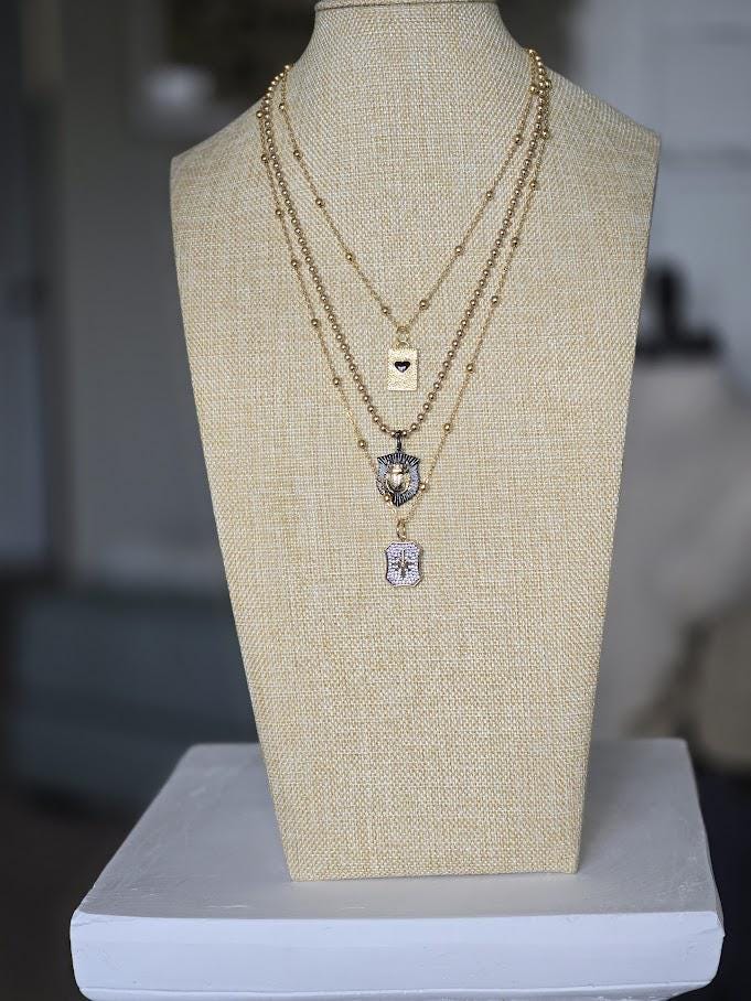 Triple Strand Necklace with Heart, Scarab & Pave Starburst Charms