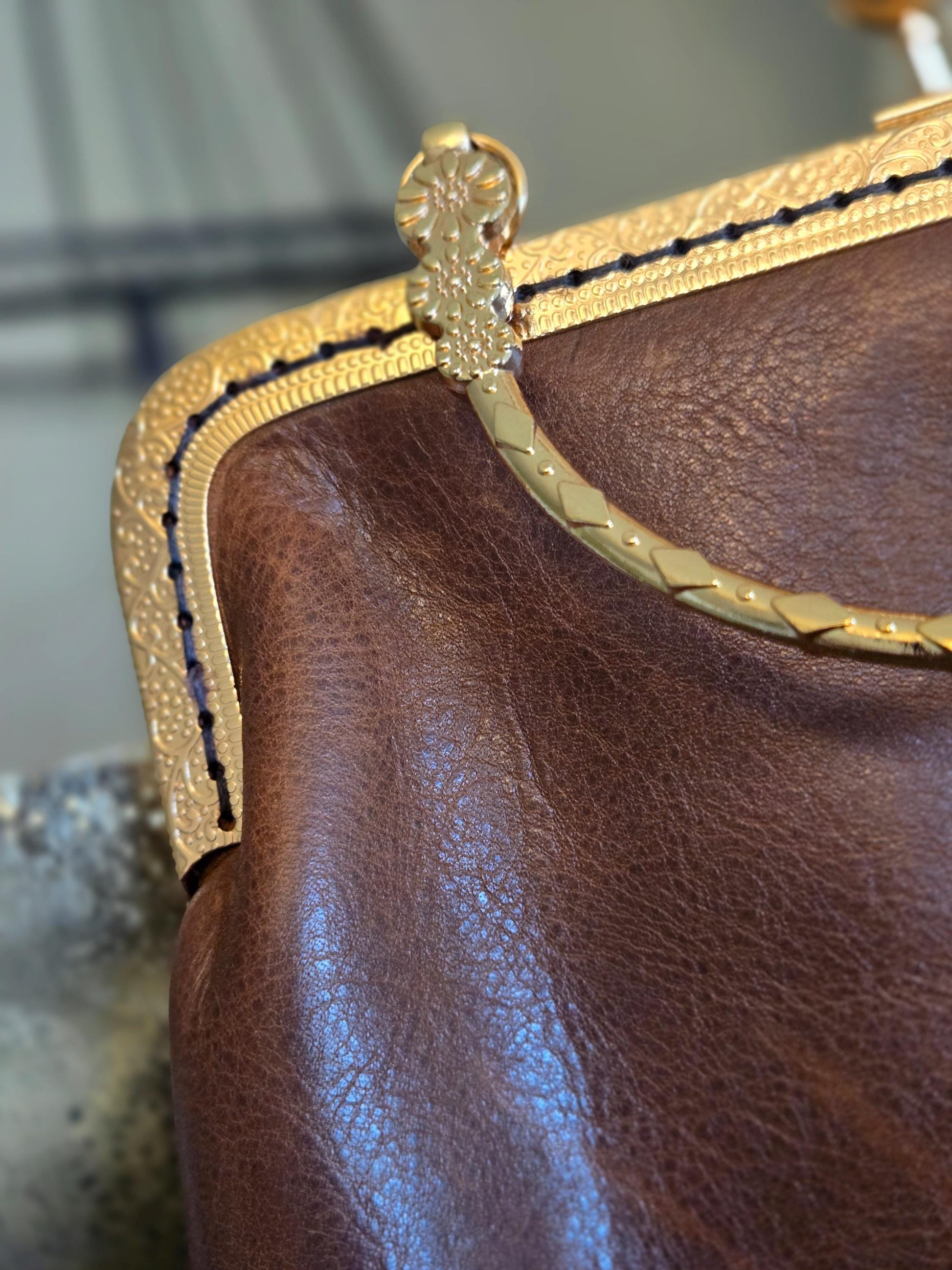 Small Brown Leather Handbag with Ball Clasp Closure