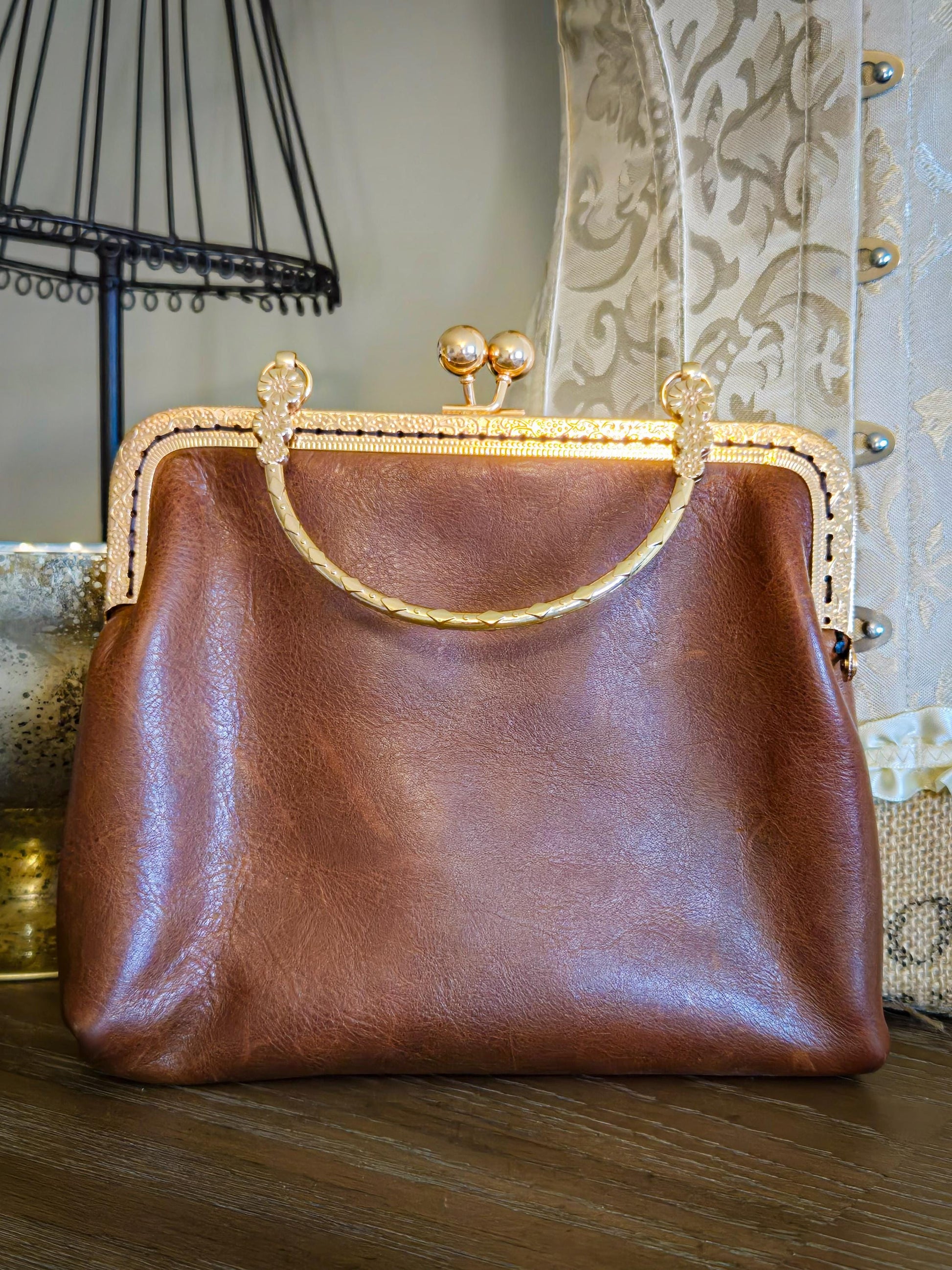 Small Brown Leather Handbag with Ball Clasp Closure