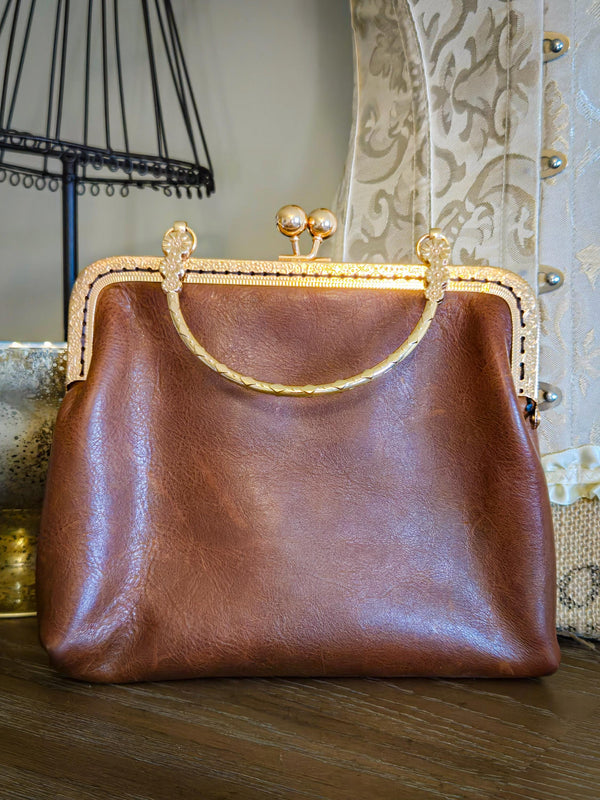Small Brown Leather Handbag with Ball Clasp Closure