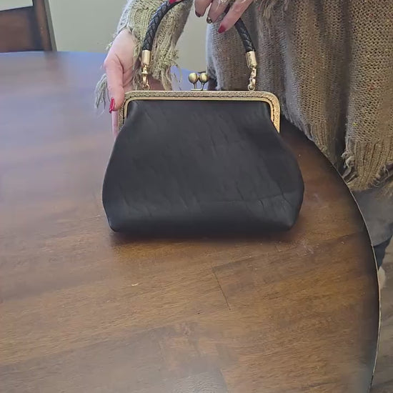 Small Black Leather Handbag with Ball Clasp Closure